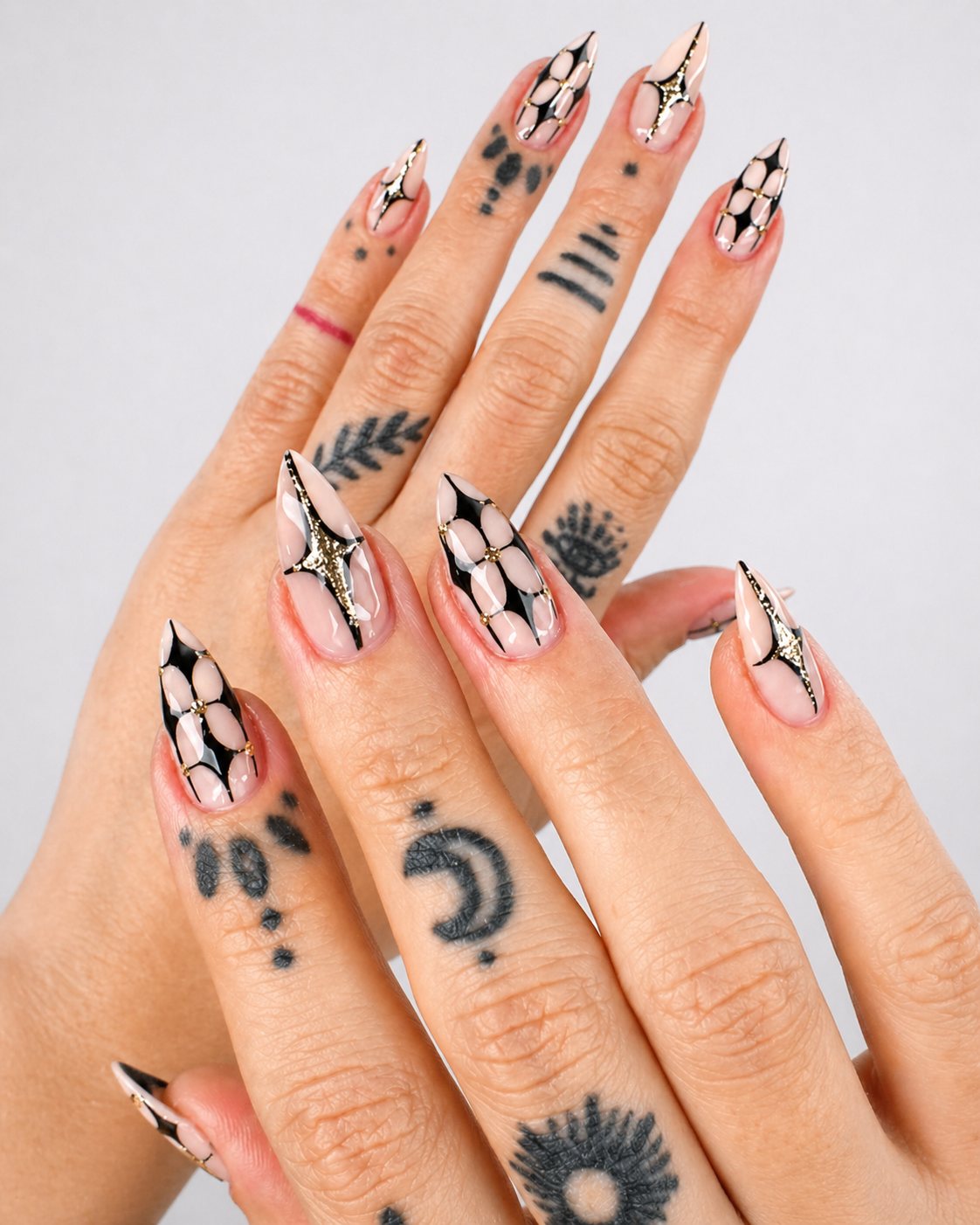 Chrome stiletto nails with nude base by Vannie